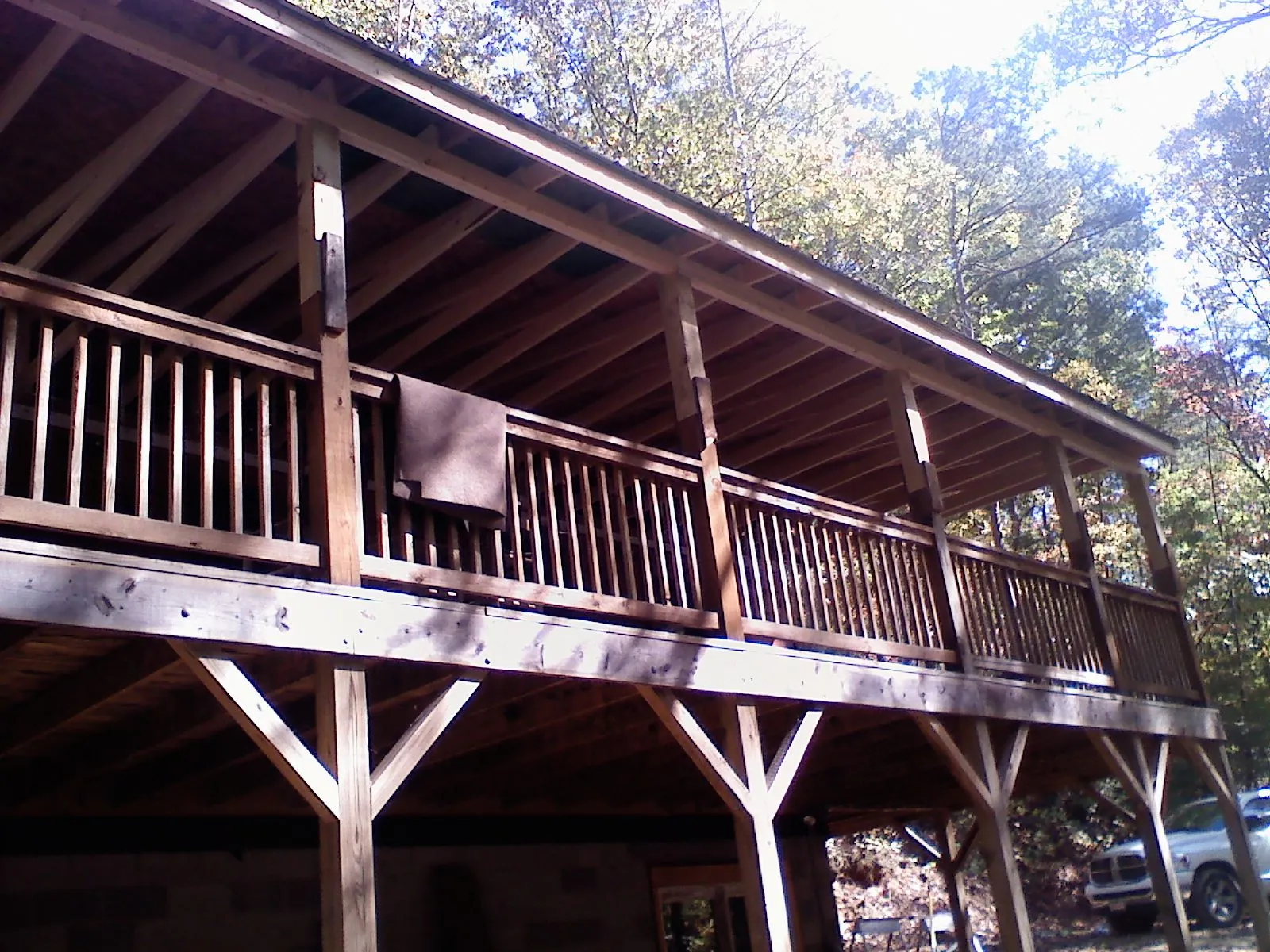 Timber framing under a new elevated porch and deck — Roof Leak Repair in Santaquin by Roofing Brothers